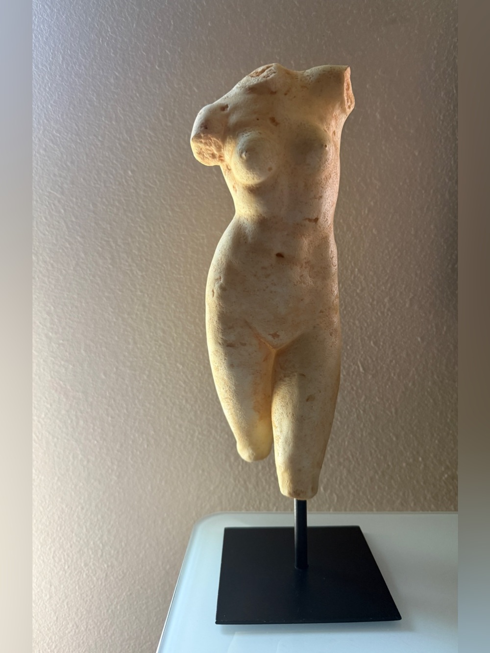 Female figure on metal stand